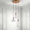 Cloud lampadario in acciaio oro opaco e 3 paralumi in vetro bianco opaco di varie dimensioni