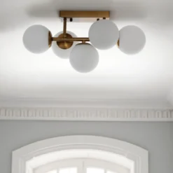 Galaxy lampadario / applique in metallo verniciato ottone opaco con sfere in vetro bianco opaco 50x27 h24 cm
