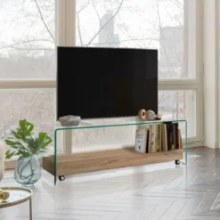 Noa Porta TV vetro curvato trasparente ripiano rovere con ruote h45 l130 p40